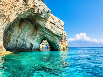 Scenic view of sea against blue sky