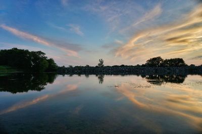 Scenic view of lake against cloudy sky