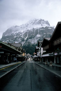 Road amidst mountains against sky