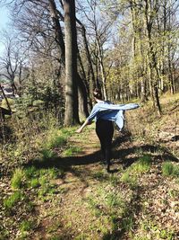 Rear view of man standing on field