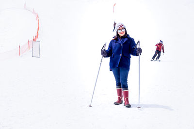 Full length of man standing in snow