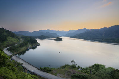 Scenic view of lake against sky during sunset