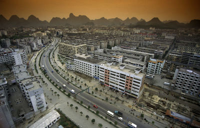 High angle view of cityscape against sky during sunset