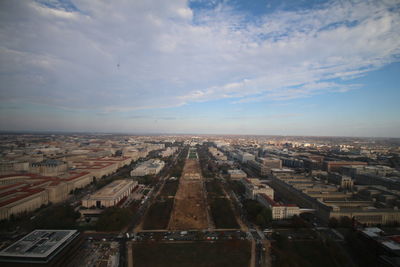 Aerial view of cityscape against sky