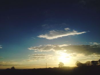 Scenic view of landscape against sky at sunset