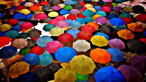 High angle view of people in multi colored umbrellas