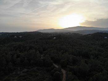 Scenic view of landscape against sky during sunset