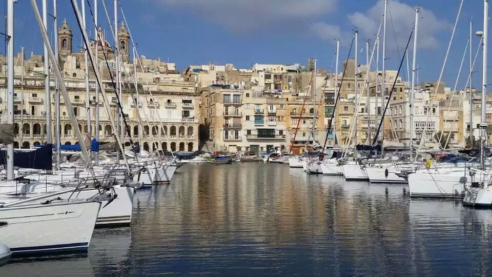 nautical vessel, building exterior, architecture, built structure, moored, harbor, water, transportation, boat, mode of transport, mast, waterfront, sky, city, sailboat, sea, panoramic, commercial dock, river, travel