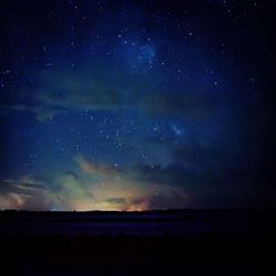 Scenic view of sea against sky at night