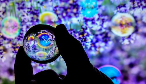 Close-up of hand holding bubbles