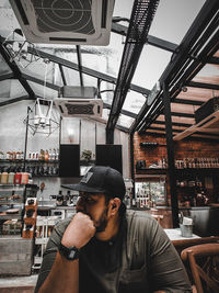 Portrait of young man in restaurant