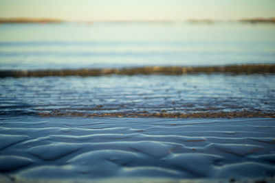 Surface level of beach against sky