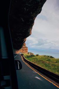 Country road seen through car window