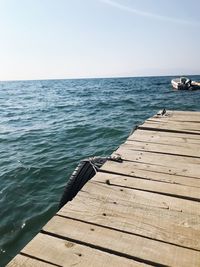 Pier over sea against clear sky