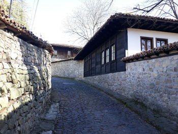 View of alley amidst buildings