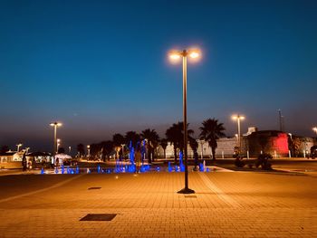 Illuminated street lights at night