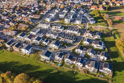 Germany, baden-wurttemberg, waiblingen, aerial view of modern energy efficient suburb in autumn