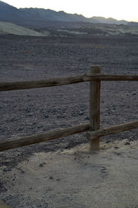 Close-up of wood on beach against sky