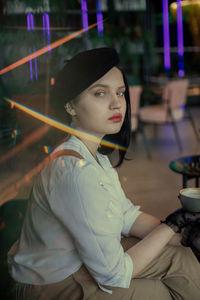 Portrait of young woman looking away