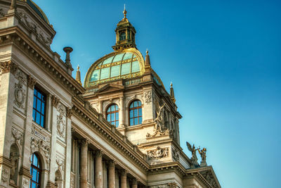 Low angle view of building against clear blue sky