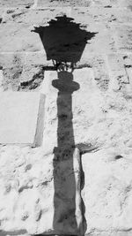 High angle view of men shadow on ground