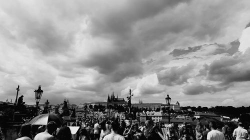 Panoramic view of crowd in city against sky