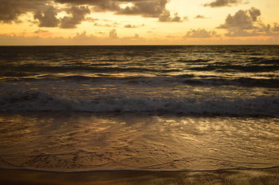 Scenic view of sea at sunset