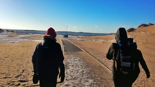 Rear view of man standing on landscape