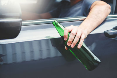 High angle view of hand holding drink