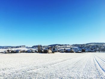 Panoramic view of landscape against clear blue sky