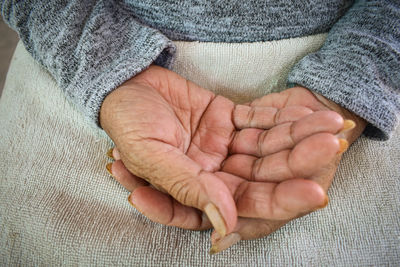 Close-up of woman holding hands