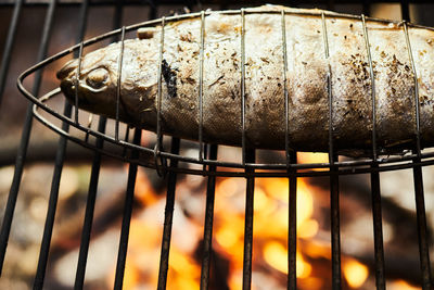 Close-up of meat on barbecue grill