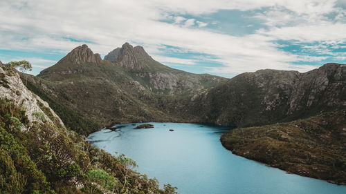 Scenic view of lake and mountains against sky