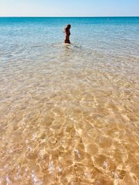 Full length of man on beach against sky