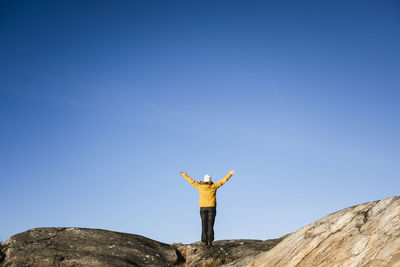 Woman standing on rocks