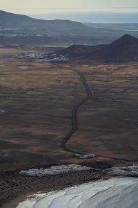 High angle view of road amidst landscape against sky