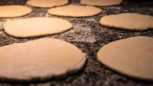 High angle view of pizza dough in kitchen