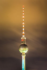 Communications tower against sky in city