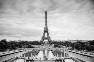 Communications tower against cloudy sky