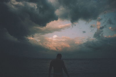 Silhouette of man standing on beach