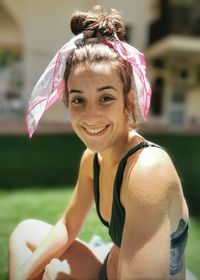 Portrait of smiling young woman wearing hat