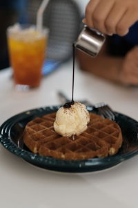 Close-up of ice cream served on table