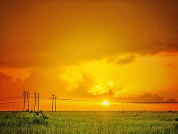 Scenic view of landscape against sky at sunset