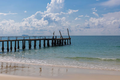 Pier over sea against sky