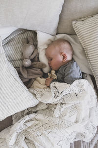 High angle view of baby sleeping