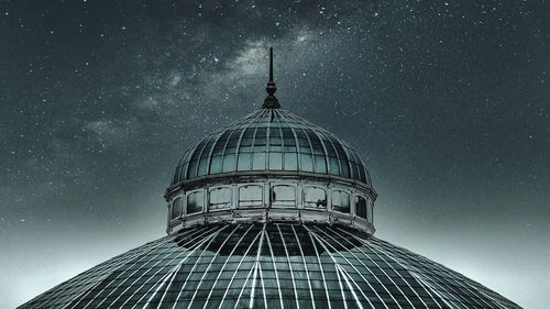 Low angle view of illuminated building against sky