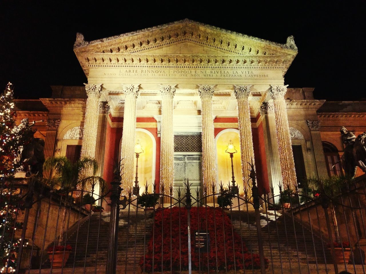 architecture, built structure, building exterior, night, illuminated, history, low angle view, place of worship, sky, entrance, facade, religion, famous place, building, travel destinations, temple - building, exterior, outdoors, old, spirituality