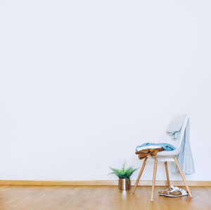 Empty chairs and tables on hardwood floor at home