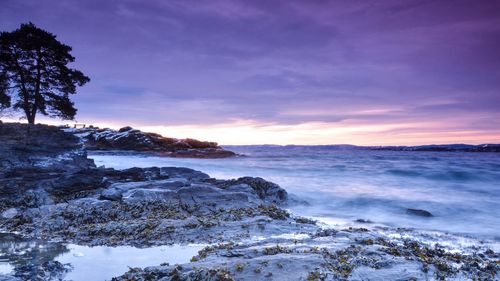 Scenic view of sea against sky during sunset