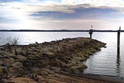 Woman on beach against sky